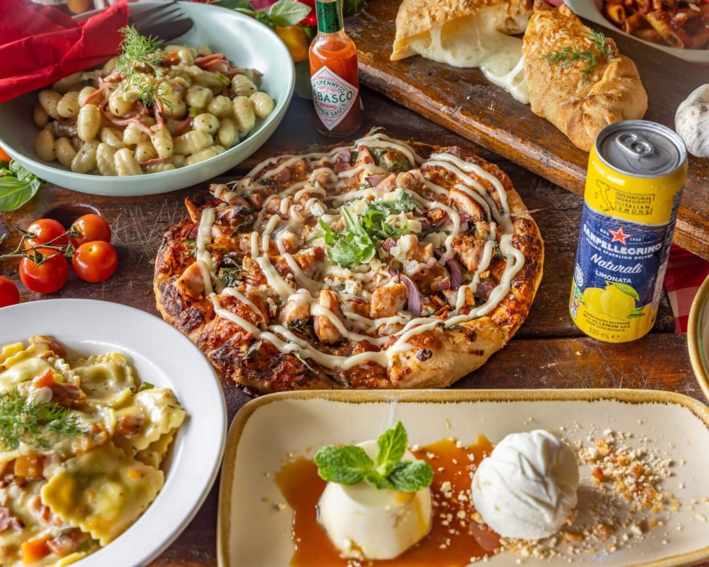 pizza at best italian restaurant in carina - elios osteria special with pasta and cheese and refreshing drinks